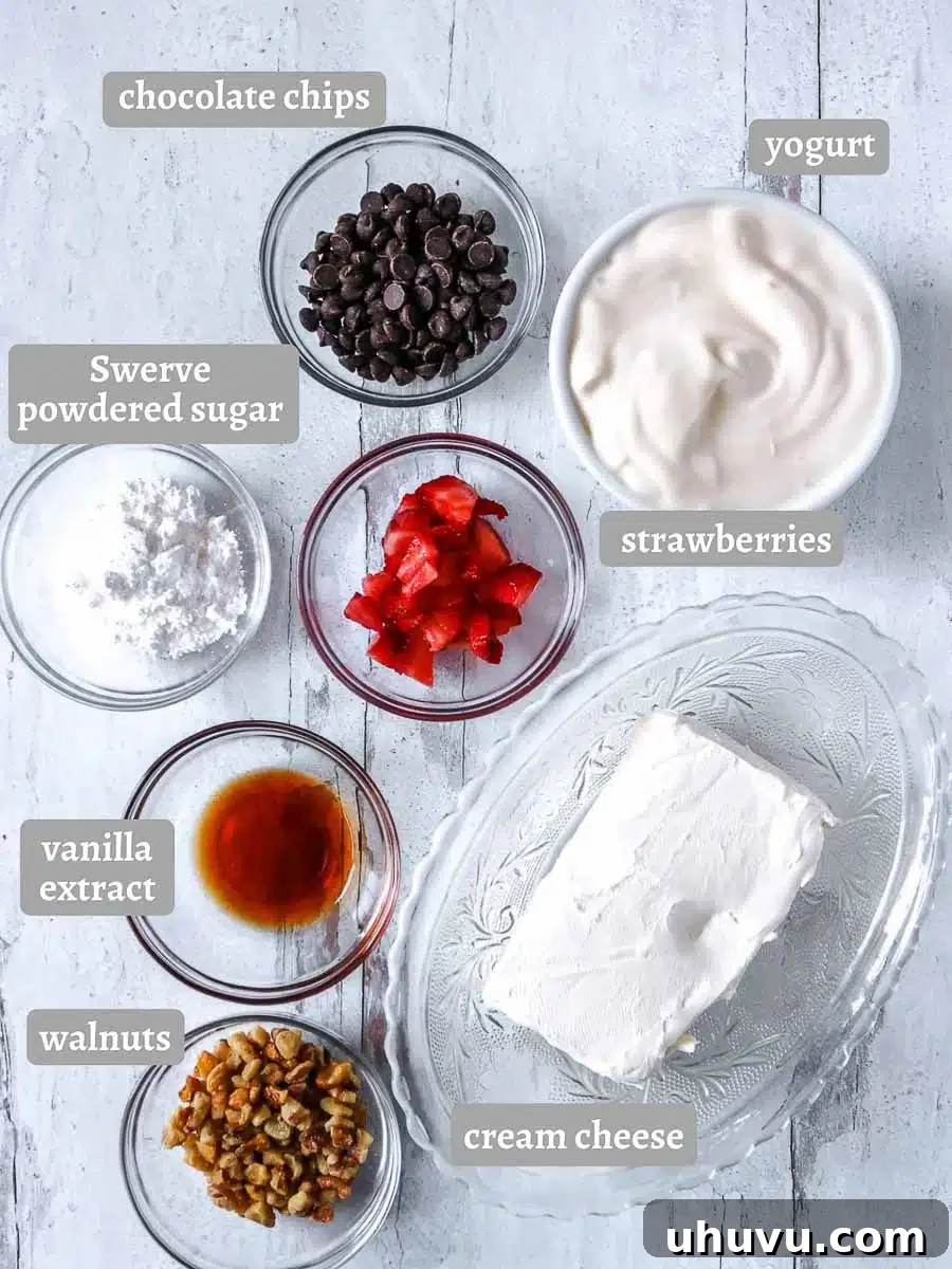 Refreshing Strawberry Frozen Yogurt Bark 4 Assortment of fresh ingredients for making frozen yogurt bark, including strawberries, walnuts, cream cheese, and Greek yogurt.