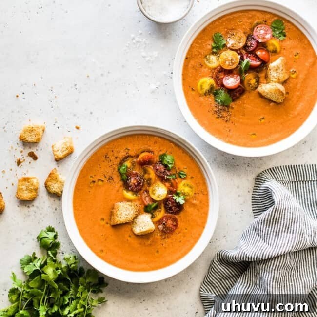 A refreshing and flavorful gazpacho recipe made from fresh sun-ripened tomatoes, cucumbers, bell peppers, onions and other simple ingredients. It's the best chilled soup you'll eat all summer! #gazpacho #summer #summerfood #soup