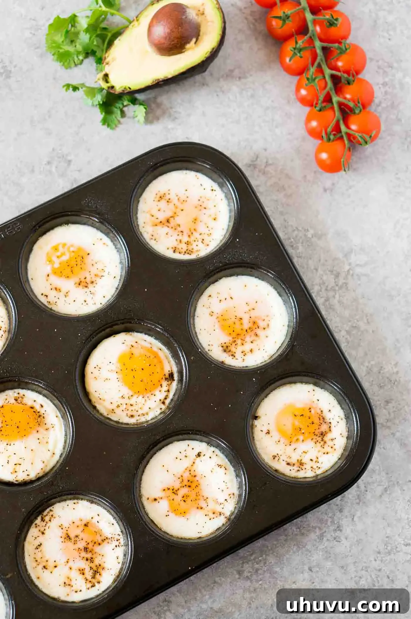 baked eggs in a muffin tin, perfectly cooked and golden