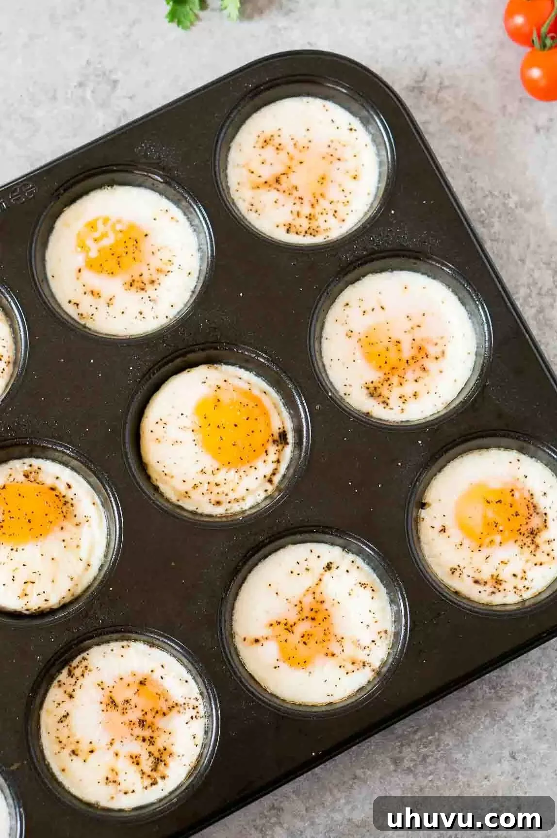 baked eggs hot out of the oven in a muffin tin