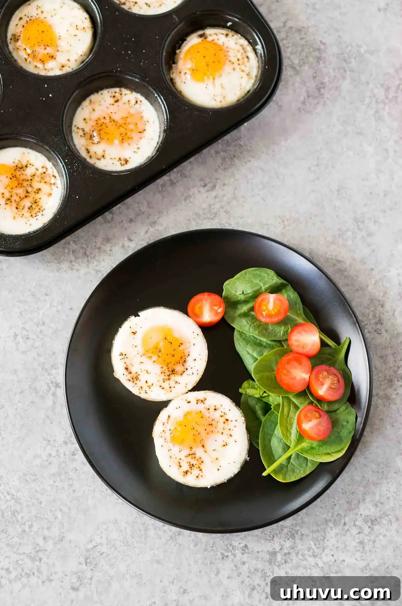 egg cups on a plate with vegetables and herbs, beautifully plated