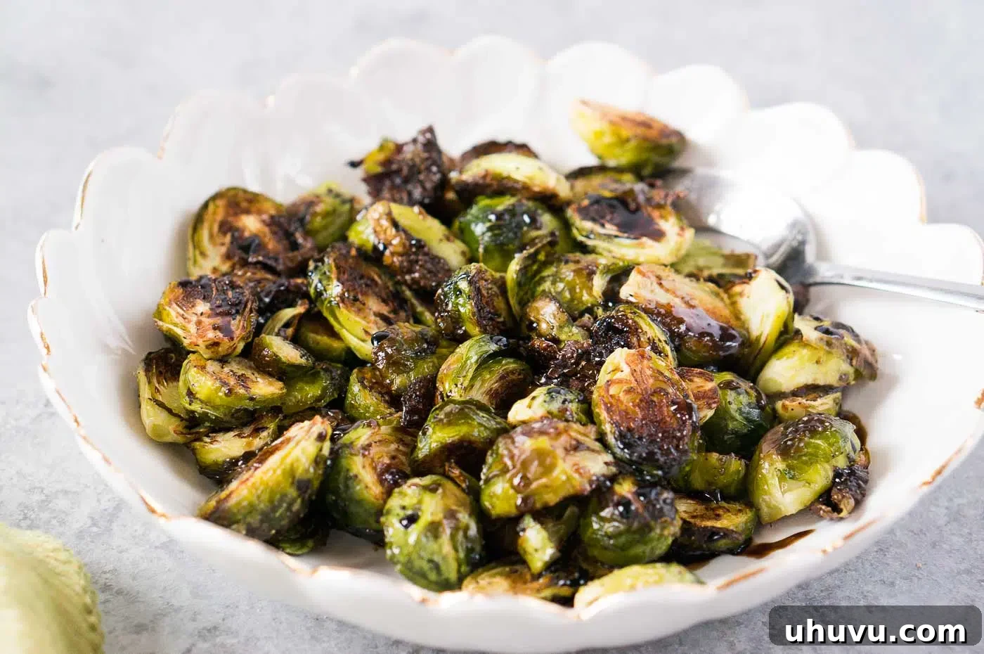 oven roasted Brussel sprouts with balsamic honey vinaigrette in a bowl