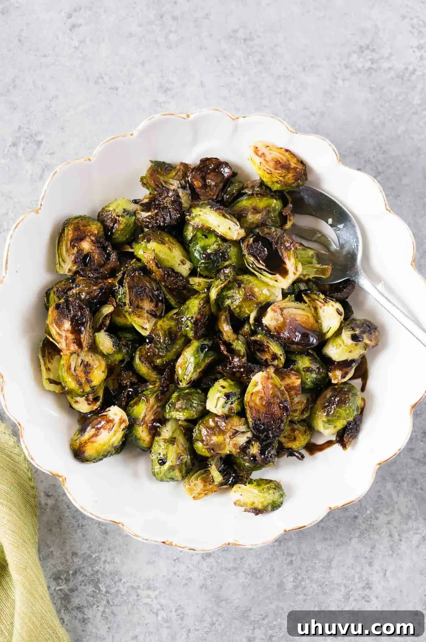 roasted Brussel sprouts with balsamic glaze served in a serving bowl