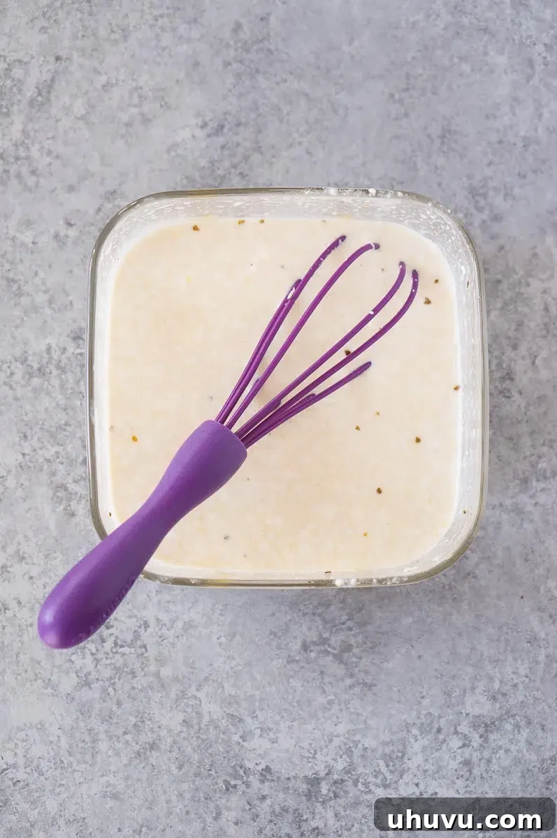 mixing cream cheese with soup