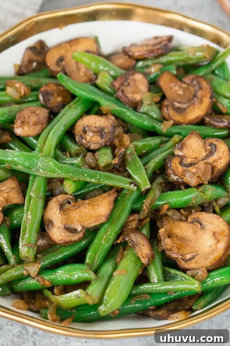 cooked green bean recipe with mushrooms in a bowl