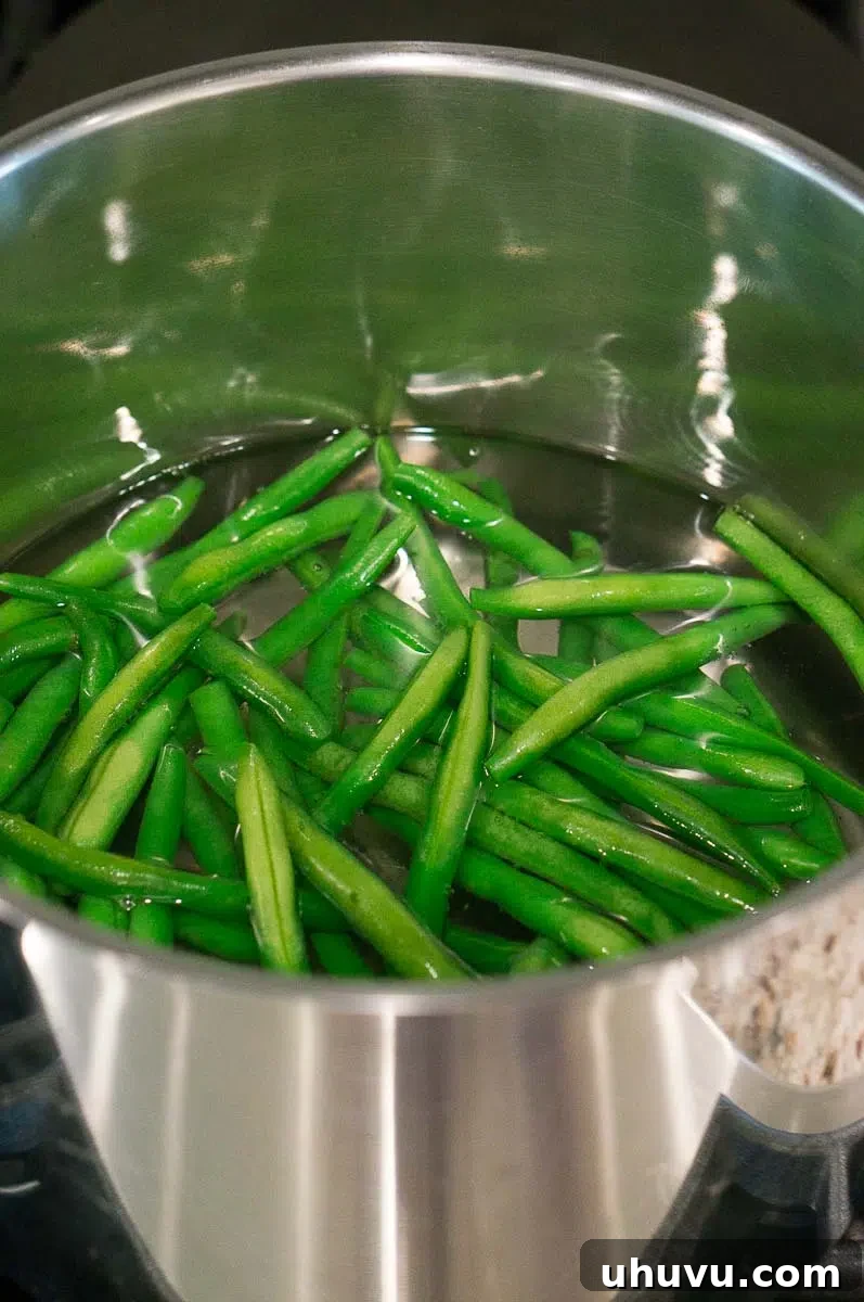 boiling green beans in a pot 