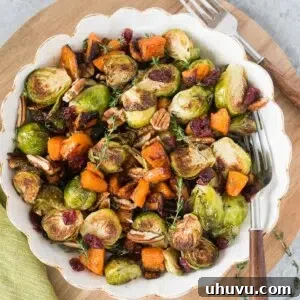 roasted butternut squash and brussel sprouts for thanksgiving in a white bowl