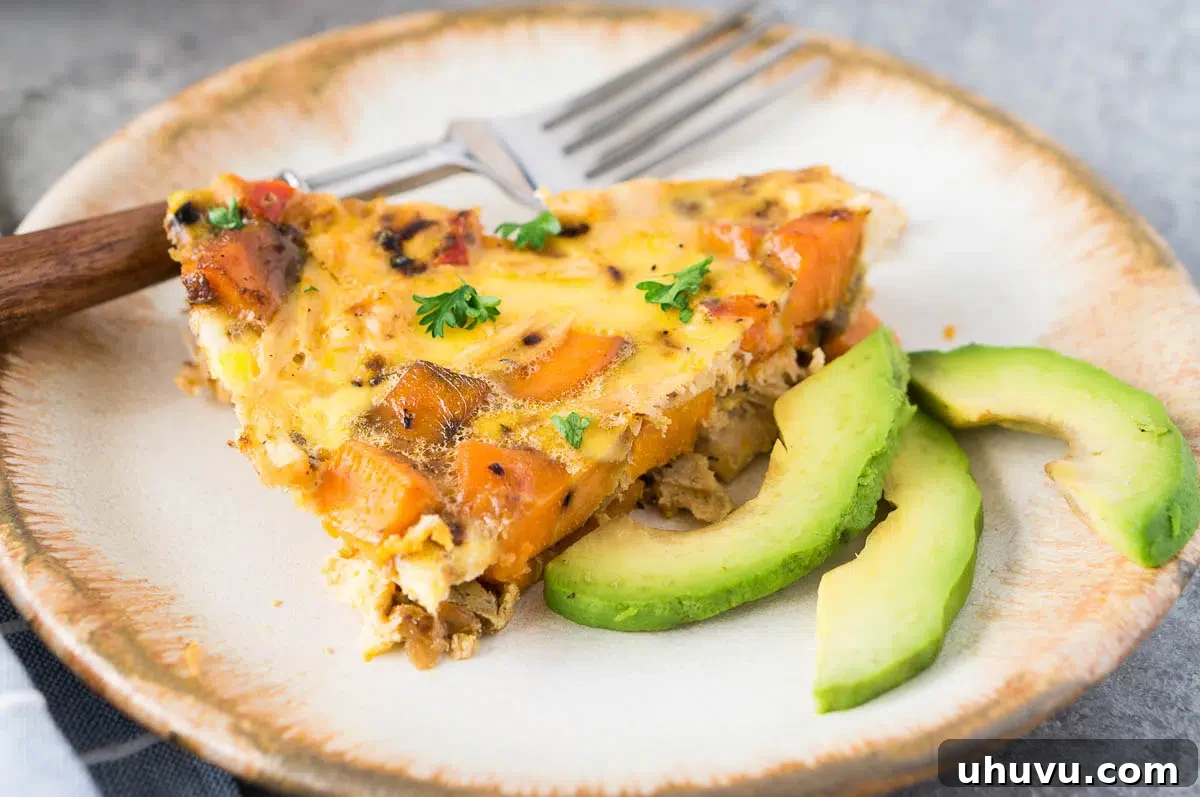 a slice of turkey and sweet potato frittata on a plate
