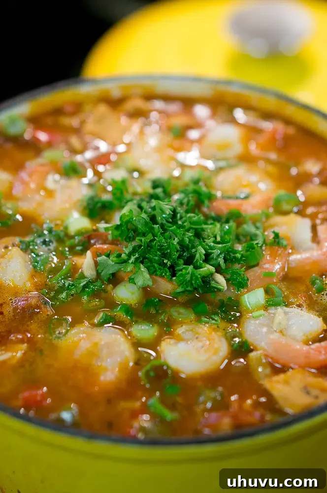 Mastering Jambalaya 7 Fresh herbs delicately placed on top of a serving of Jambalaya, adding vibrant color and aroma.