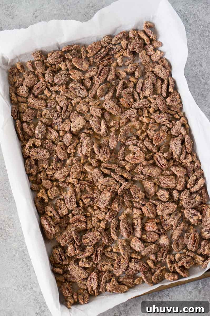 Homemade Candied Pecan Perfection 6 oven baked candied pecans on a baking sheet