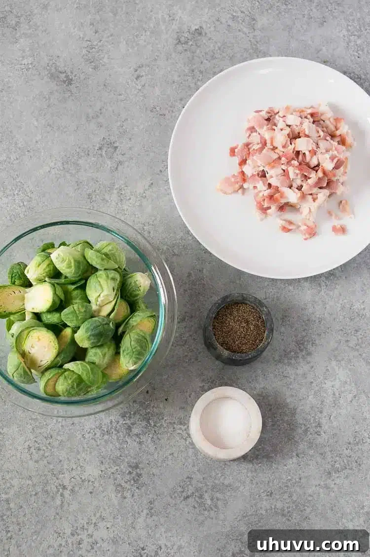 Ingredients for roasted Brussels sprouts and bacon: fresh sprouts, garlic, olive oil, salt, pepper, and diced bacon