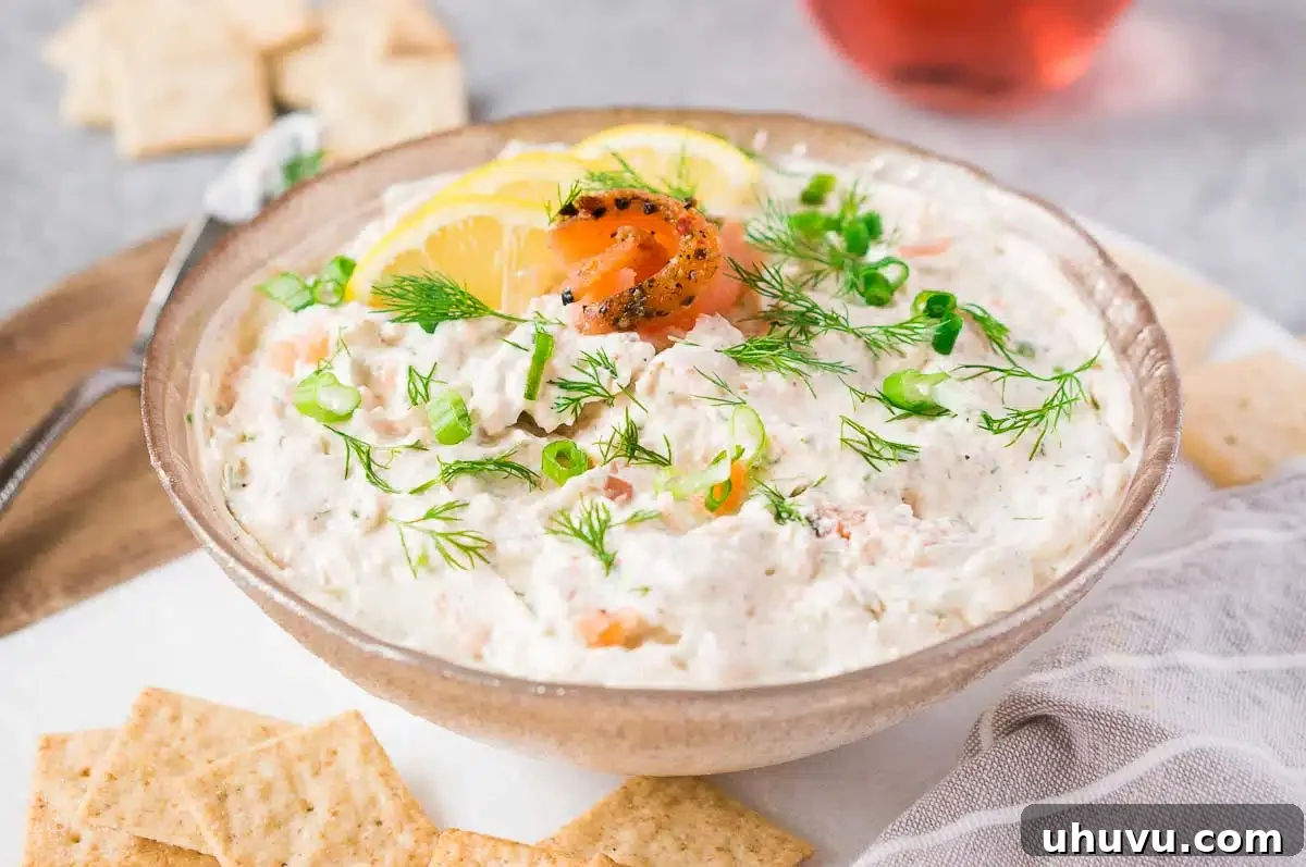 smoked salmon dip with crackers in a bowl ready to serve