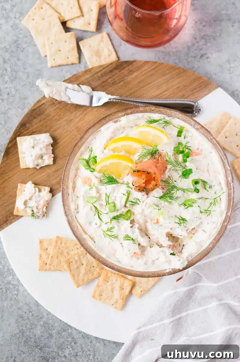 smoked salmon spread recipe in a bowl with fresh herbs