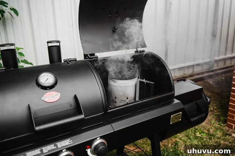 A Char Griller Texas Trio Grill featuring a chimney starter, essential for igniting charcoal quickly and efficiently.