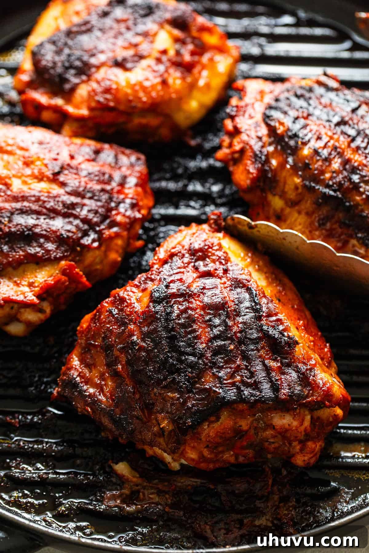 Flavorful Roasted Chicken 5 Pollo asado cooking on a grill pan, showing delicious char marks and a vibrant color.