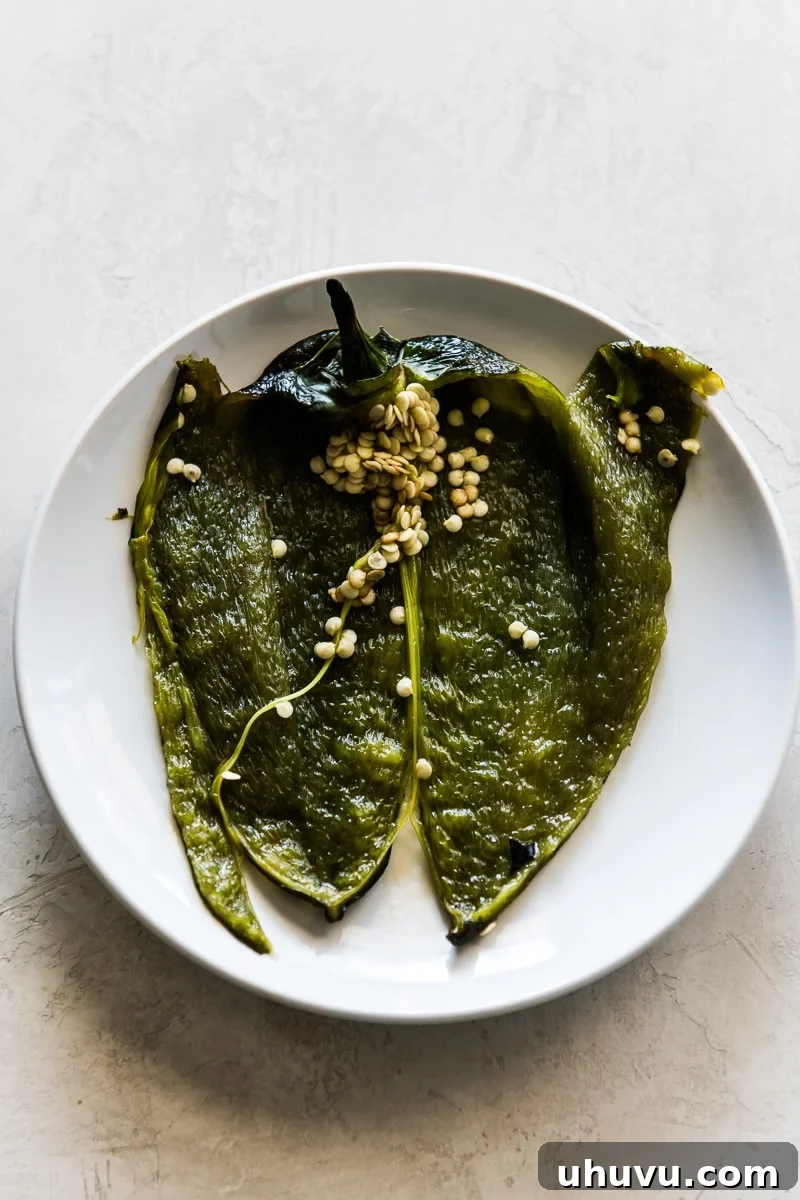 A roasted poblano pepper sliced open