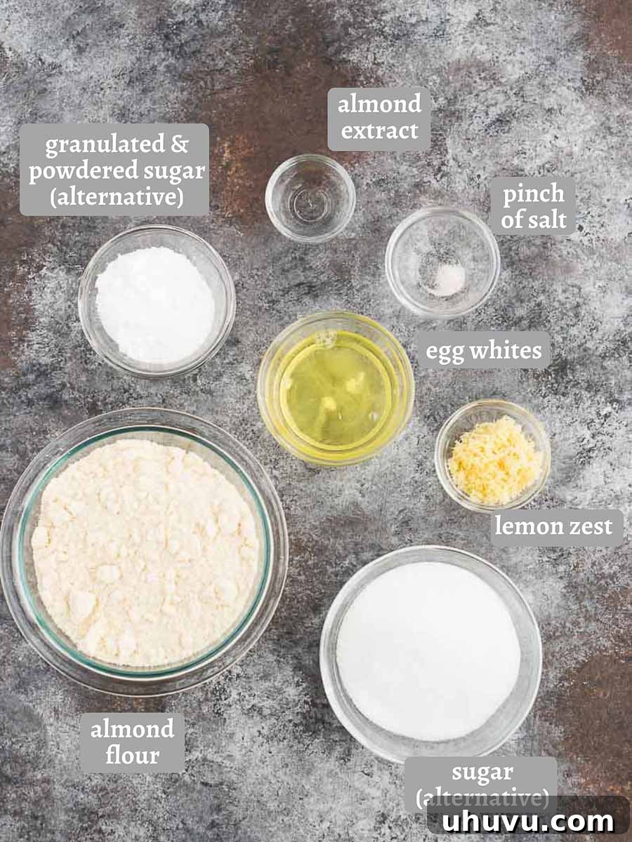 Classic Italian Amaretti 4 Arrangement of ingredients for Amaretti cookies, including almond flour, sugar, eggs, and fresh lemons, on a wooden board.