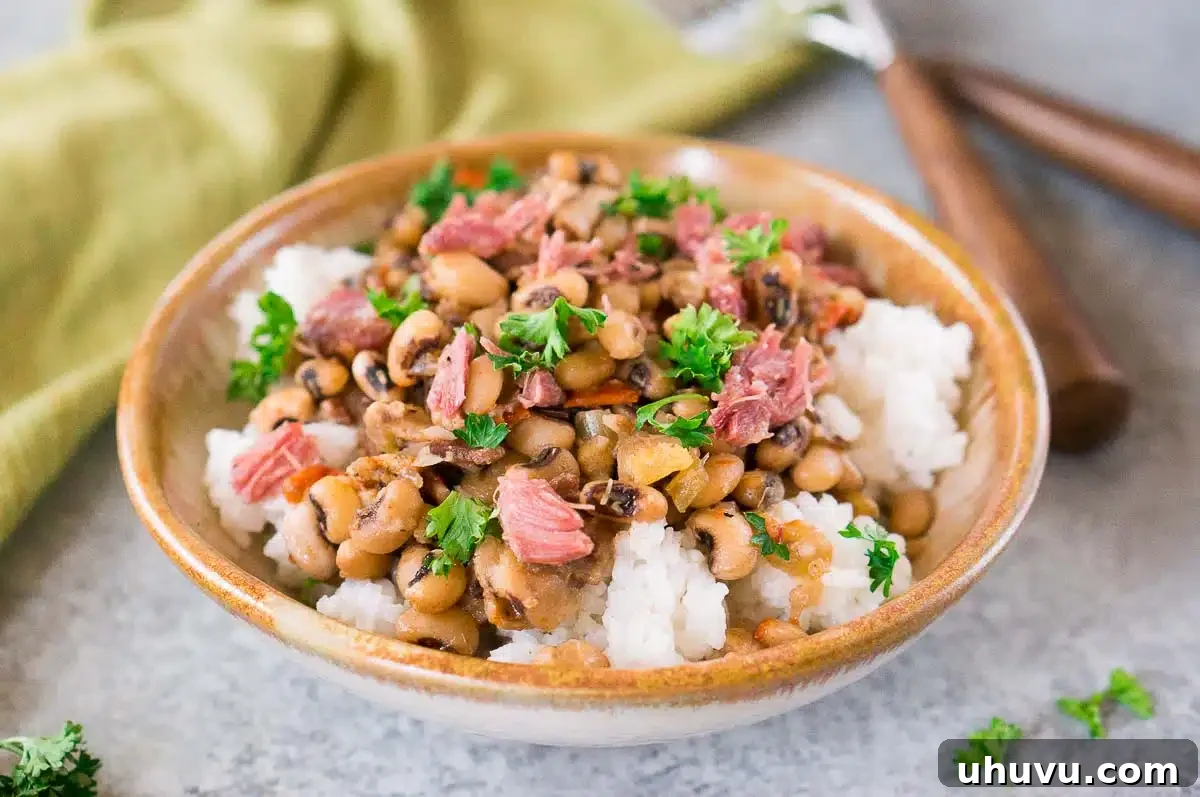 instant pot hoppin john over rice in a bowl