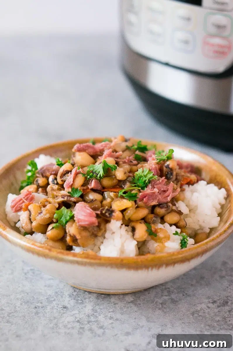black eyed peas and ham over rice in a bowl