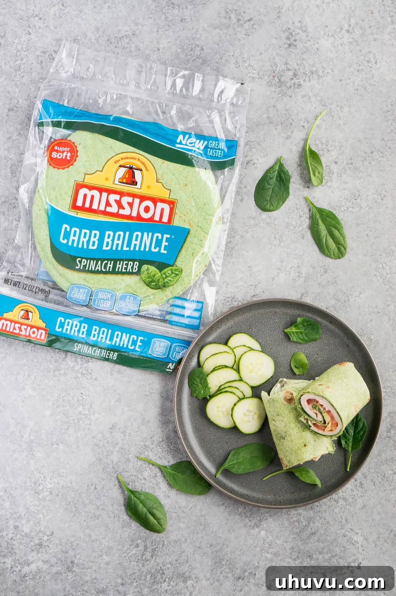 A low carb turkey club wrap standing upright on a white background