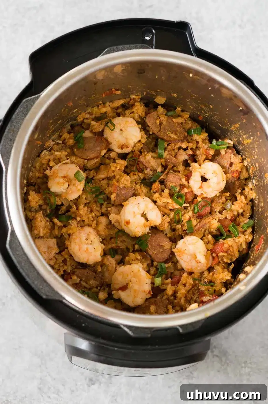 adding shrimp to the jambalaya
