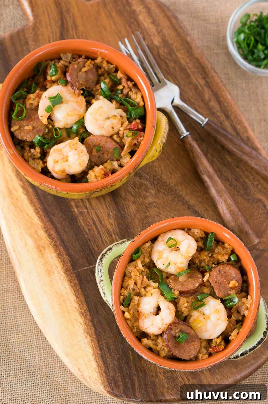 Quick and Easy Instant Pot Jambalaya 9 bowls with jambalaya on a board