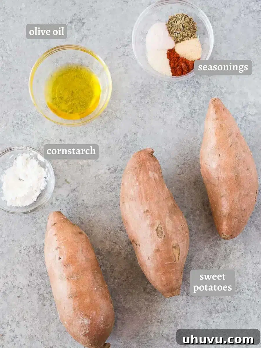ingredients for sweet potato wedges laid out on a wooden board
