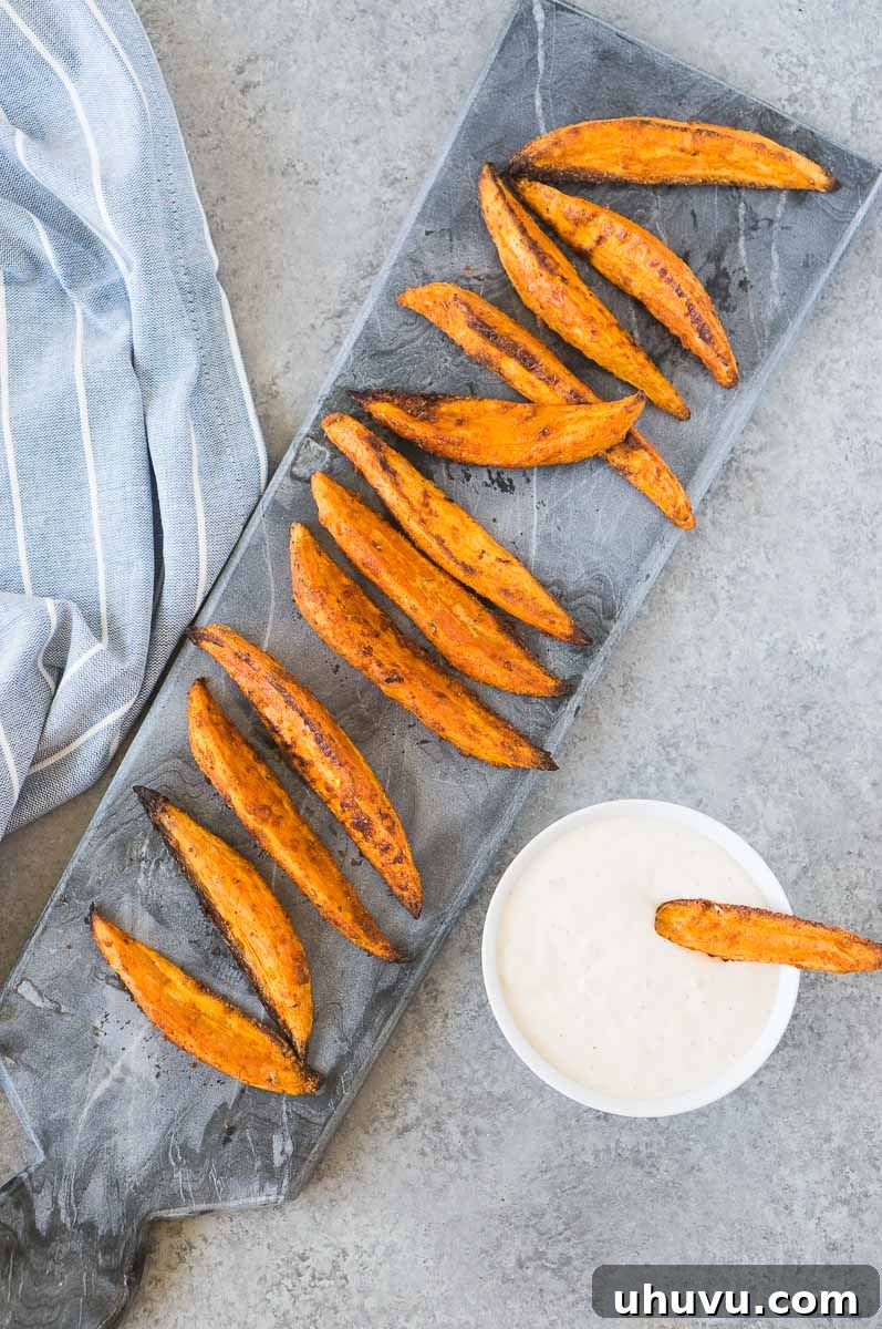 oven baked potato wedges with dipping sauce, elegantly presented