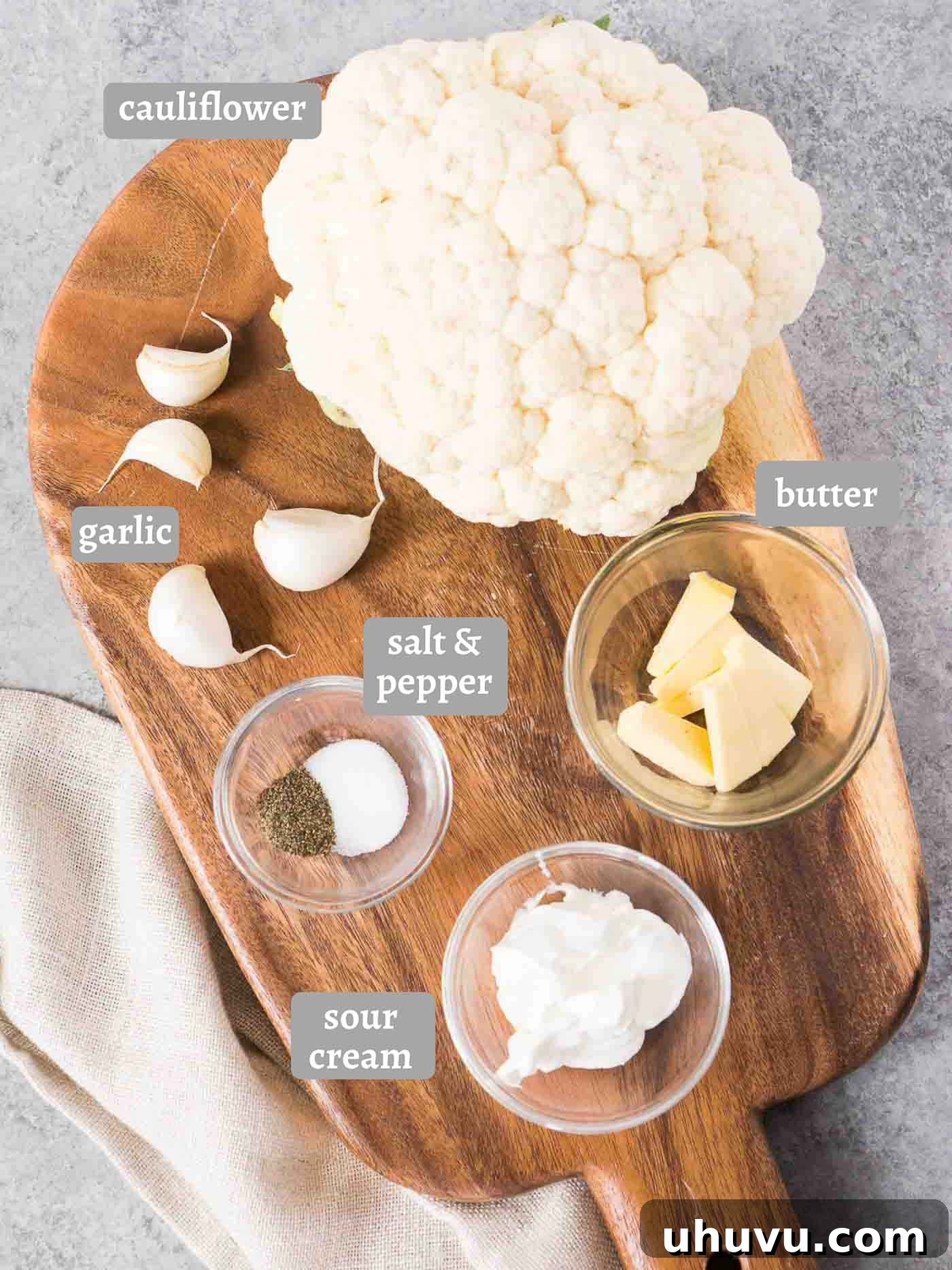 Velvety Cauliflower Puree 4 Ingredients laid out for making creamy garlic mashed cauliflower.