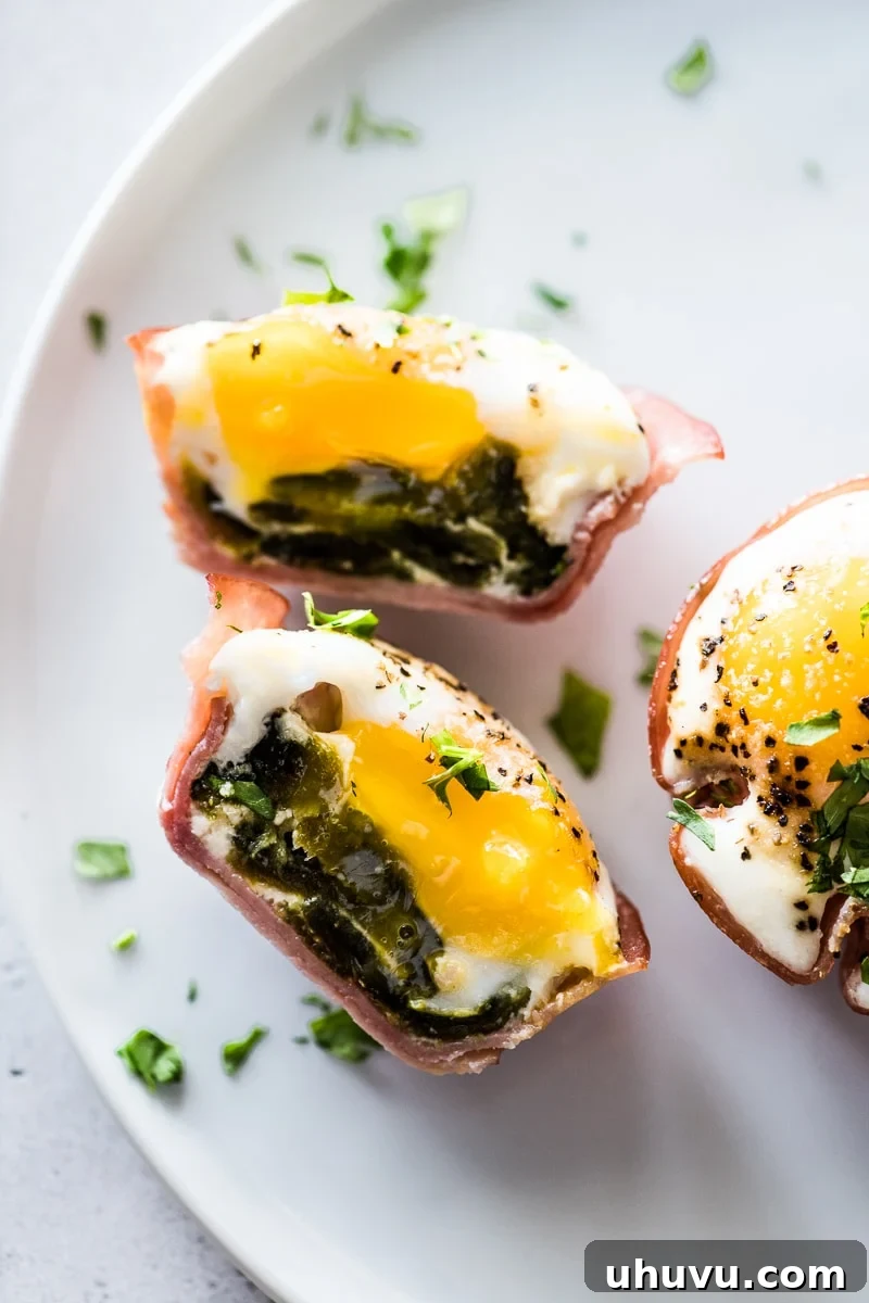 Poblano and Ham Egg Bake 6 A baked egg sliced in half to show a layer of ham, roasted poblanos and eggs.