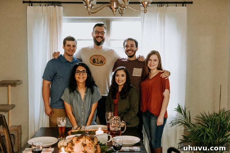 Friendsgiving Fun: Tips, Tricks, and Treats 13 A joyous group picture of friends celebrating Friendsgiving together.