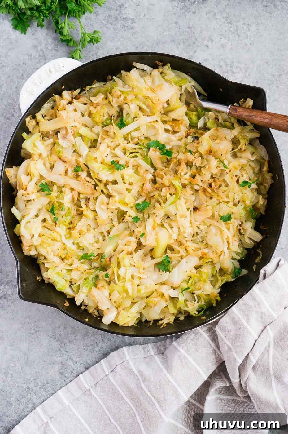 Golden Skillet Cabbage 6 Close-up of caramelized sautéed cabbage in a black skillet, showing tender, slightly browned edges.