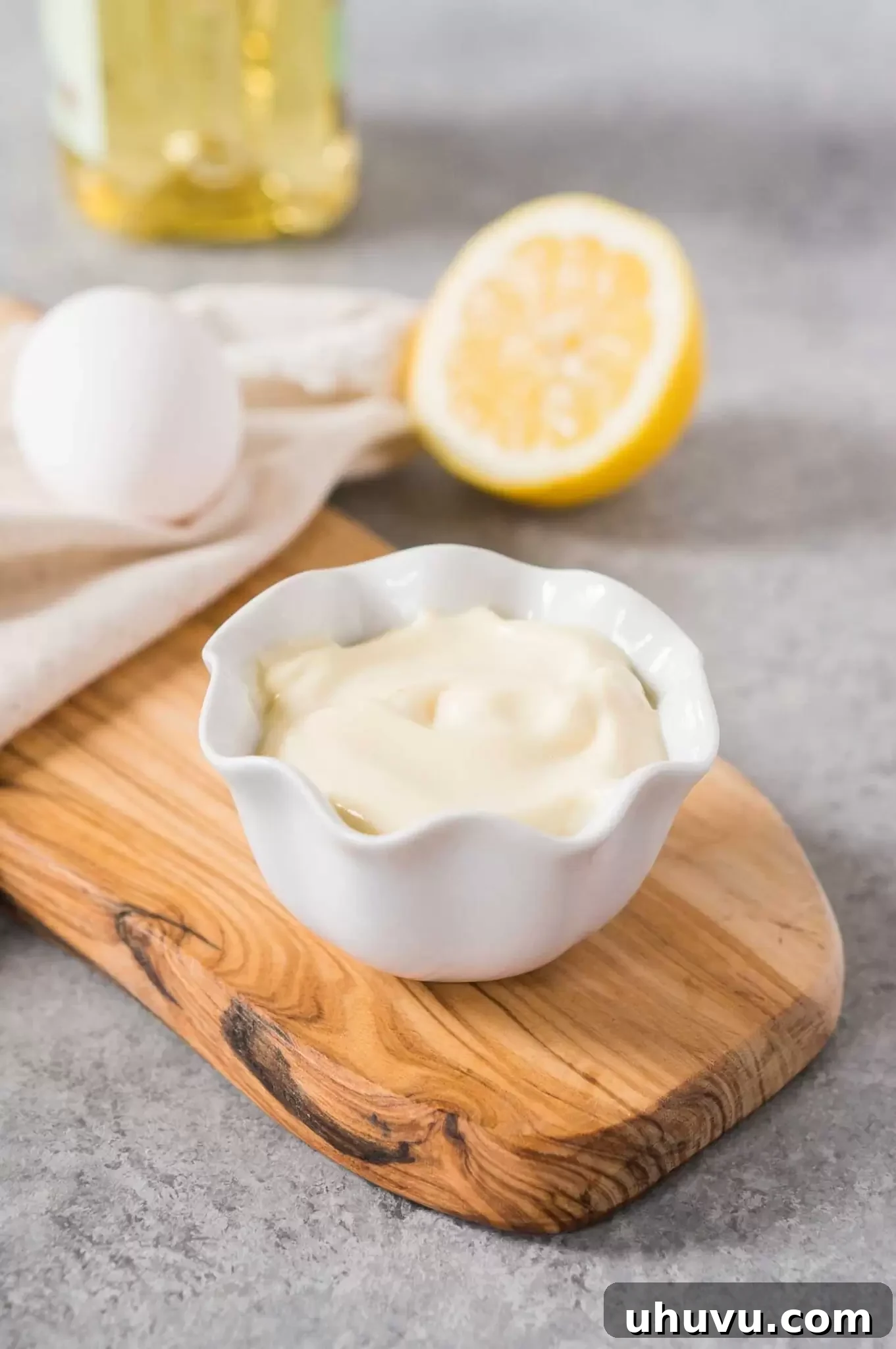 Creamy homemade mayonnaise in a white bowl, ready to be served