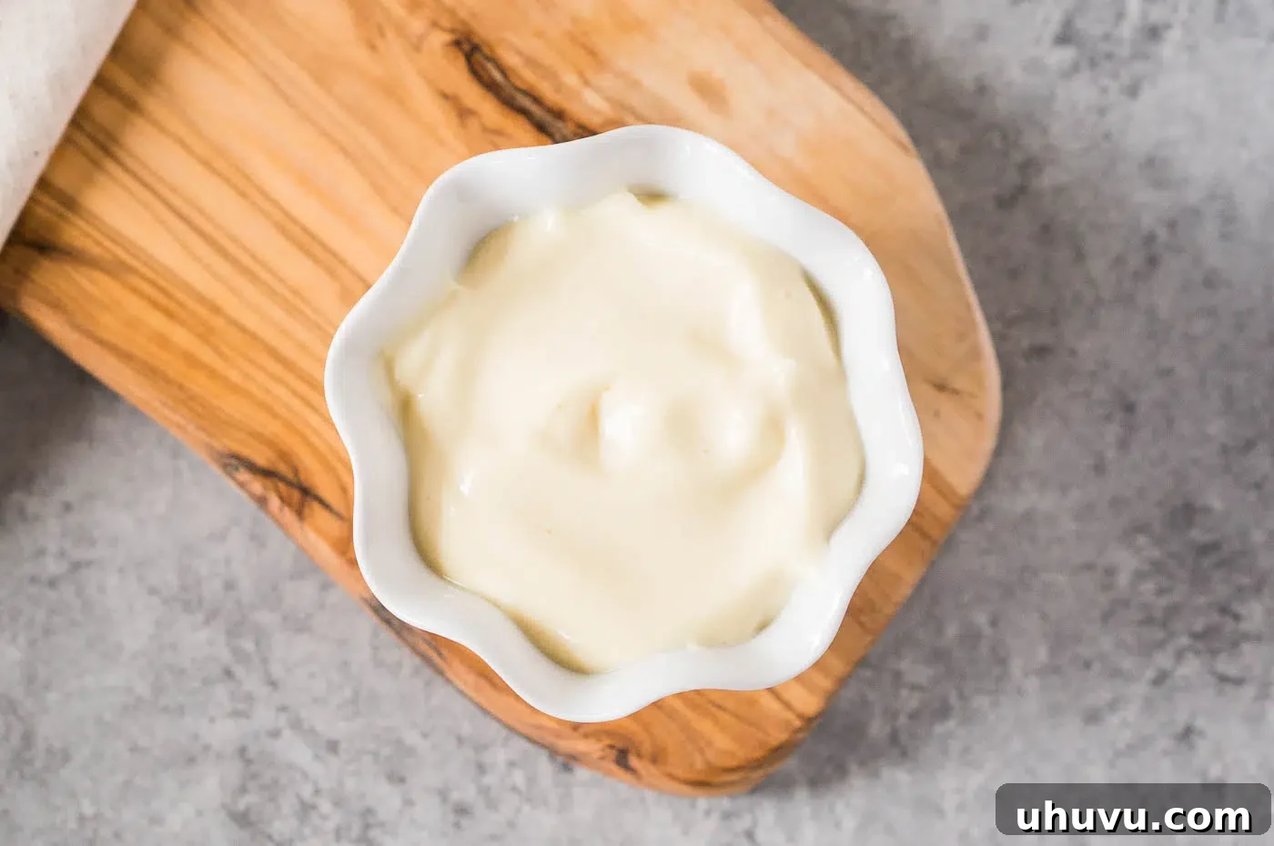 A smooth, creamy bowl of freshly made mayonnaise, ready to be used