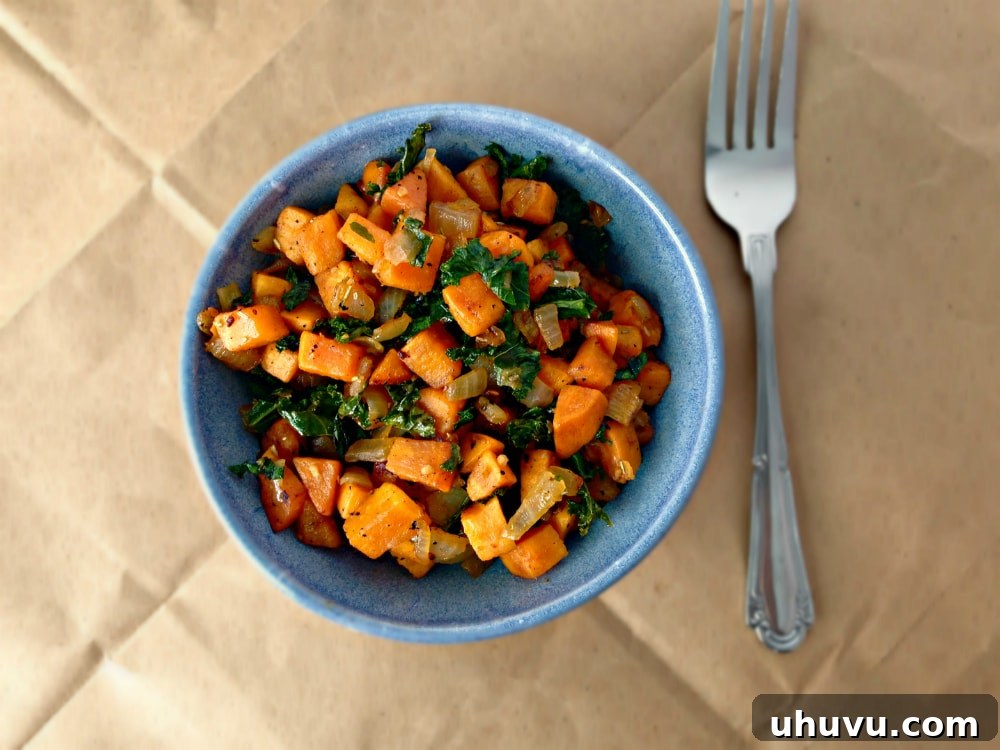 Close-up of Kale and Sweet Potato Breakfast Hash with aromatic herbs
