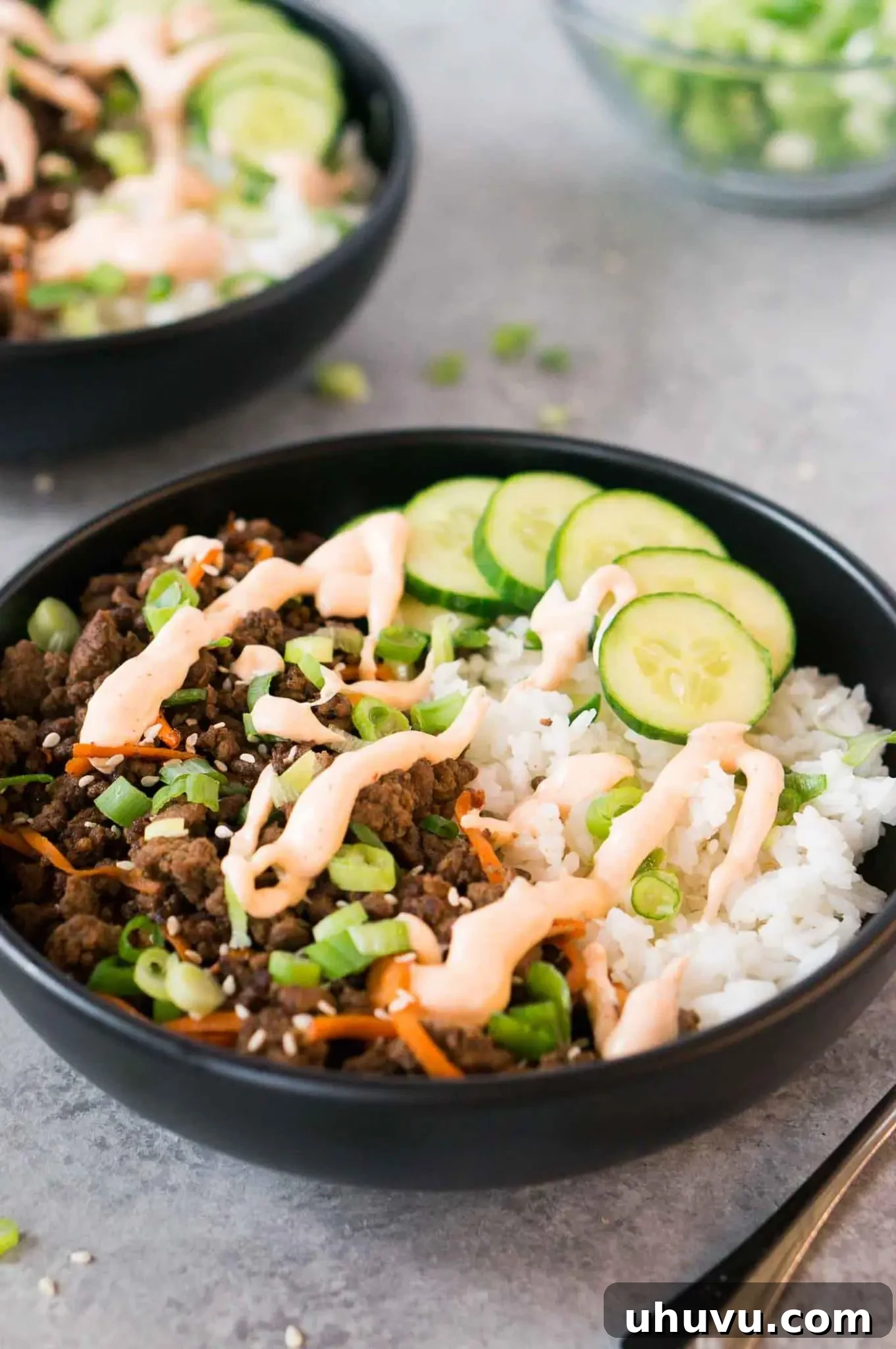 Appetizing Korean beef bowl topped with creamy sriracha mayo, served with rice