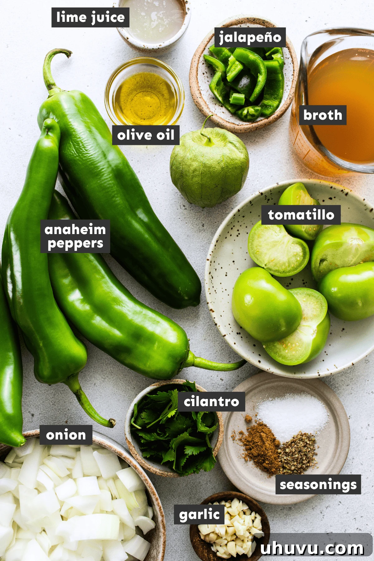 Zesty Green Enchilada Sauce 3 Various fresh ingredients for green enchilada sauce laid out on a wooden board
