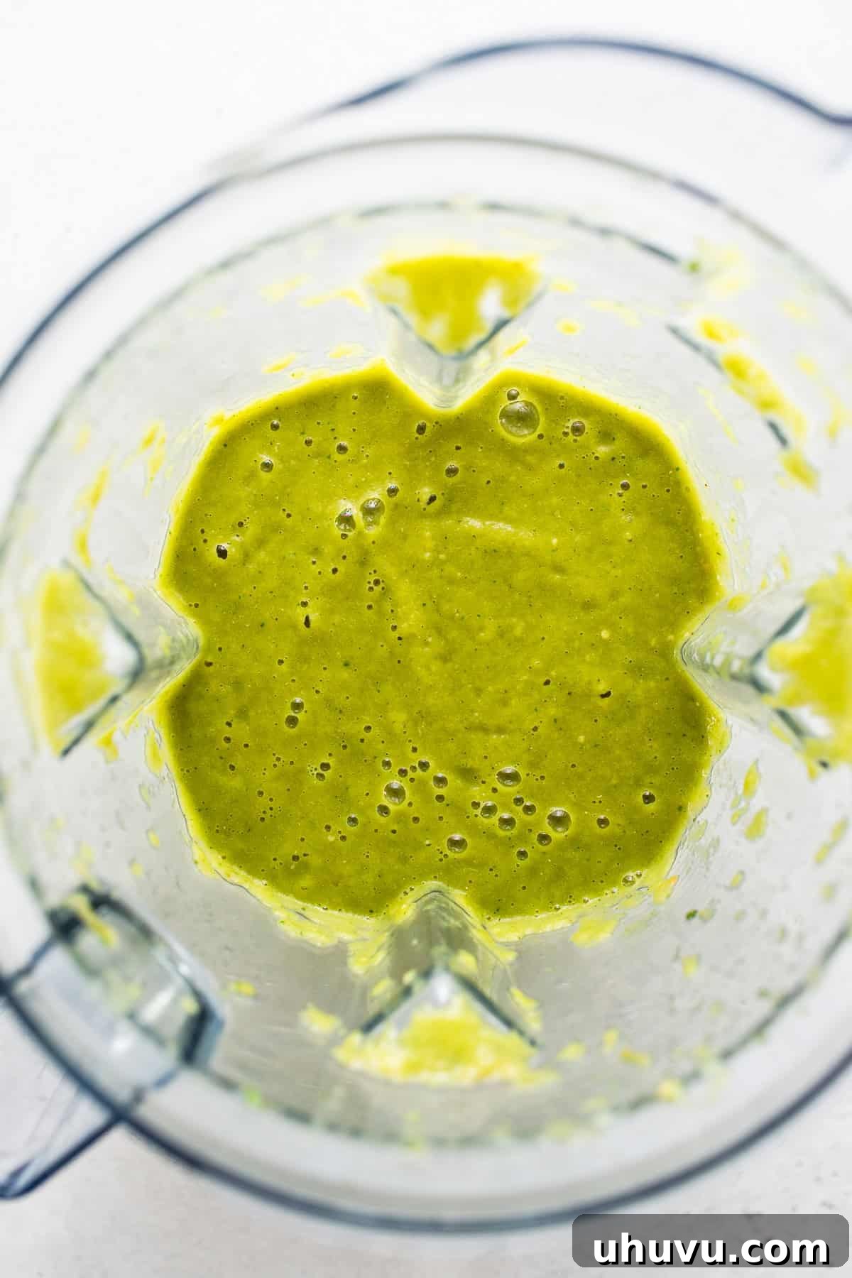 Zesty Green Enchilada Sauce 6 All ingredients for green enchilada sauce in a blender, being processed until smooth