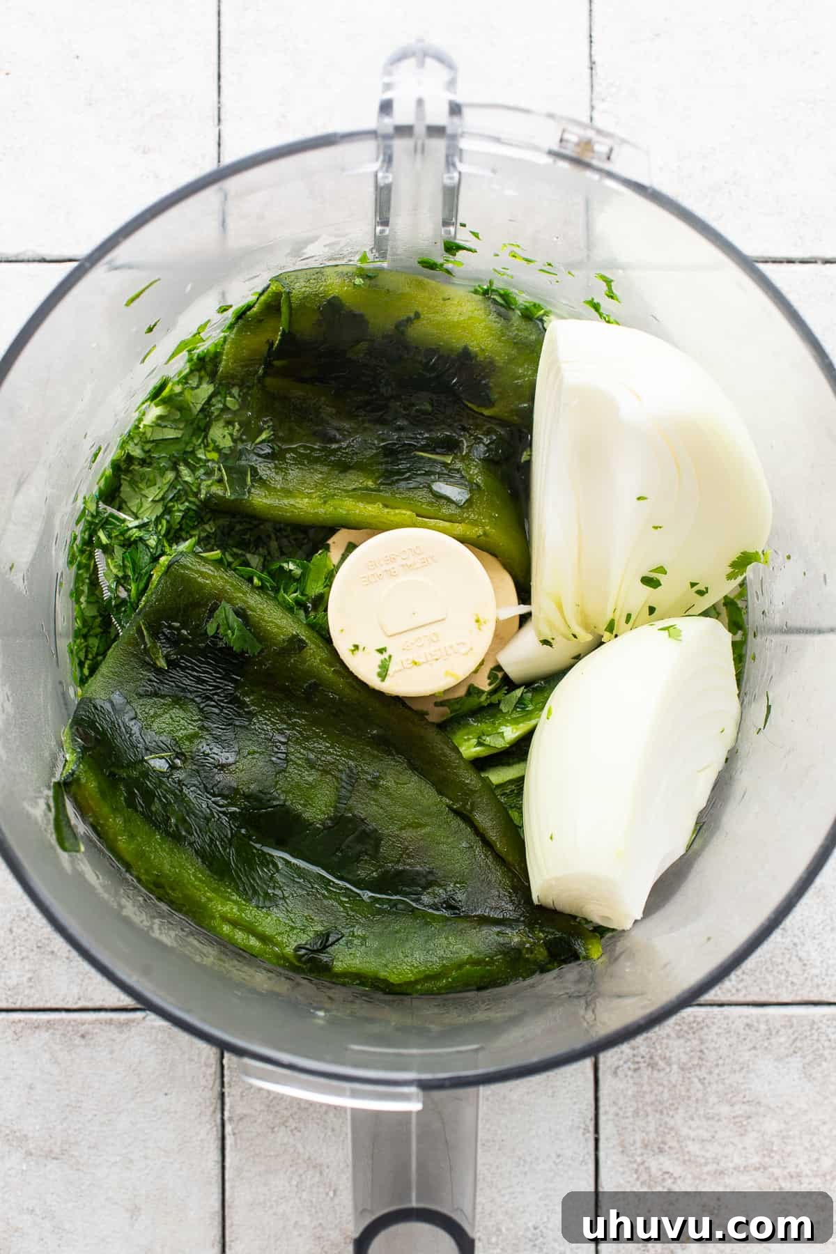 Zesty Green Rice 4 Roasted poblanos, cilantro, parsley, and onion in a food processor, ready to be blended for the verde mixture.