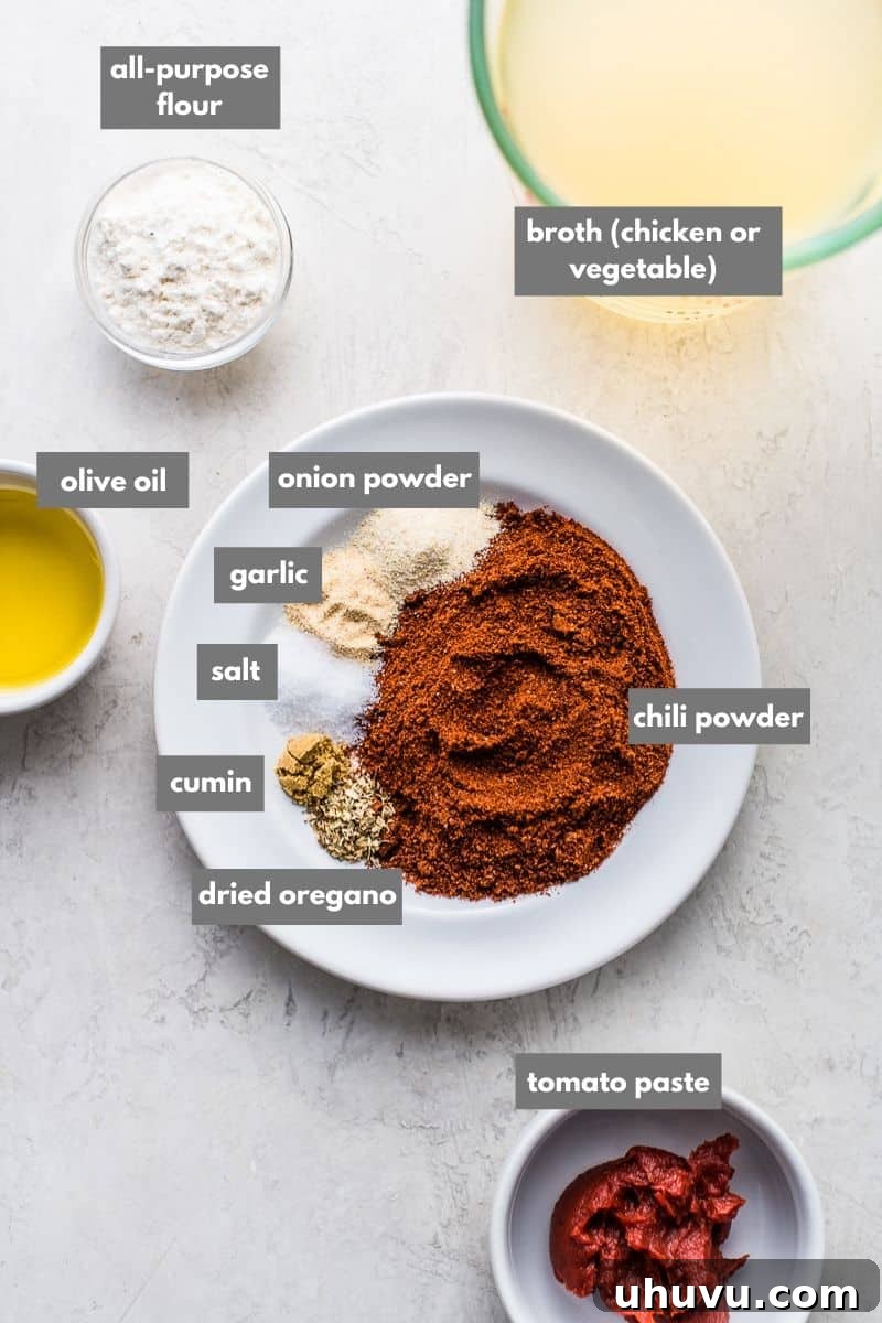 Essential ingredients for quick enchilada sauce including chili powder and broth.