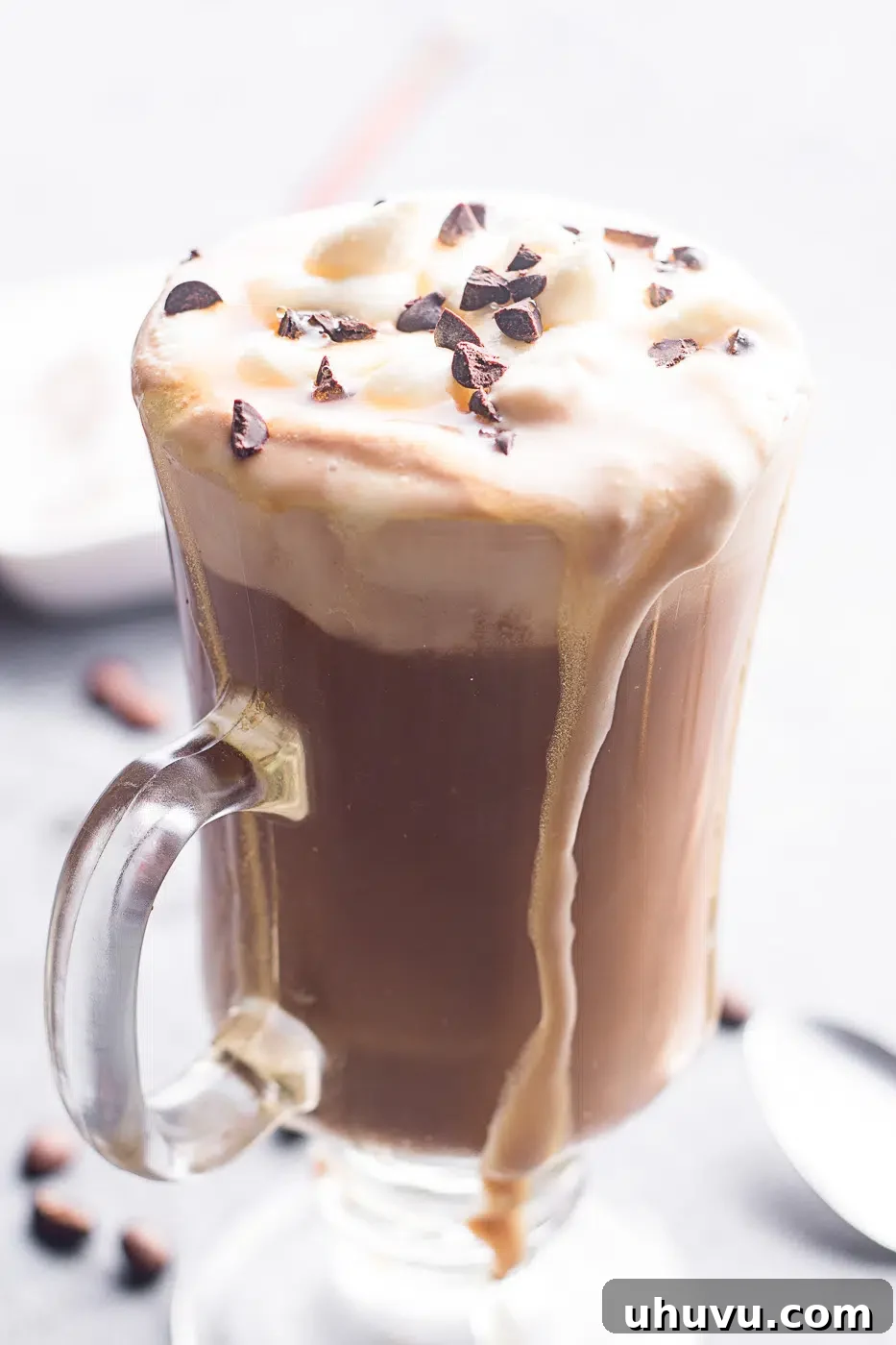 coffee with milk and cocoa served in a tall glass 