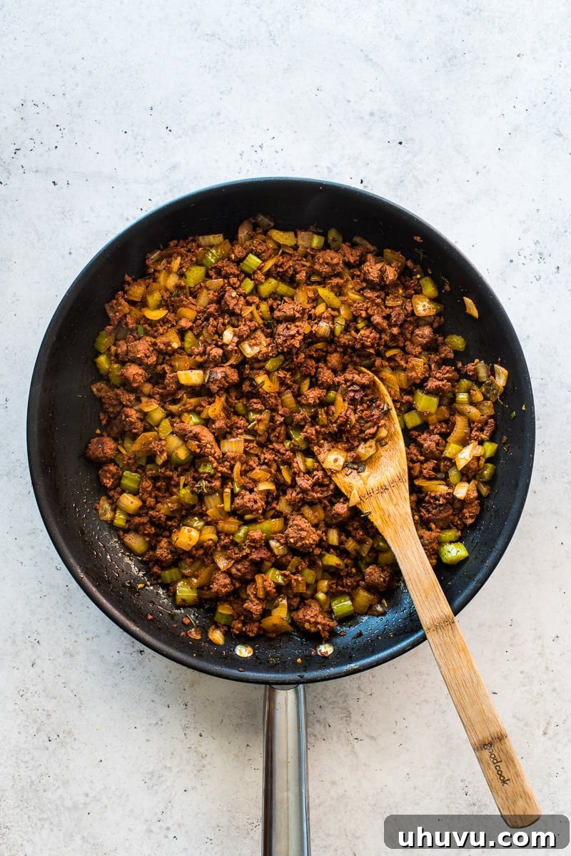 Ingredients for cornbread stuffing in a skillet