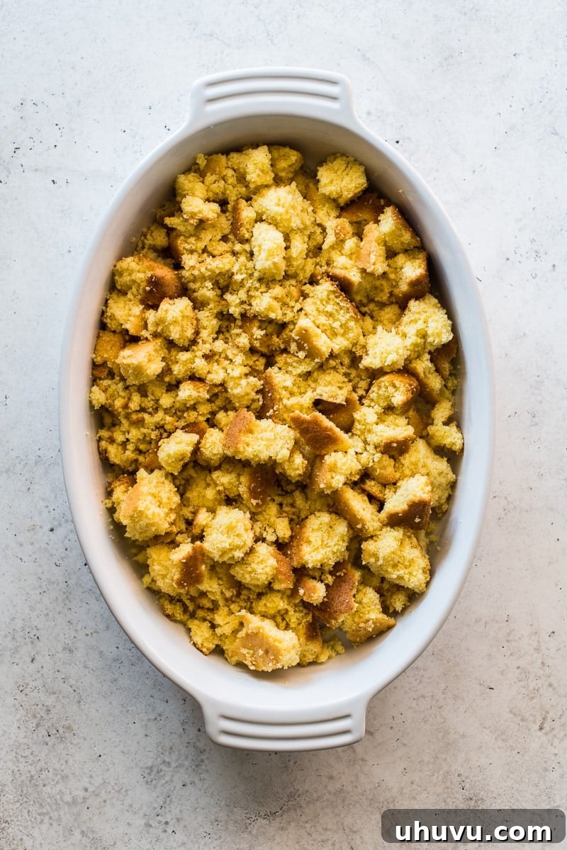 Chopped cornbread in a baking dish.