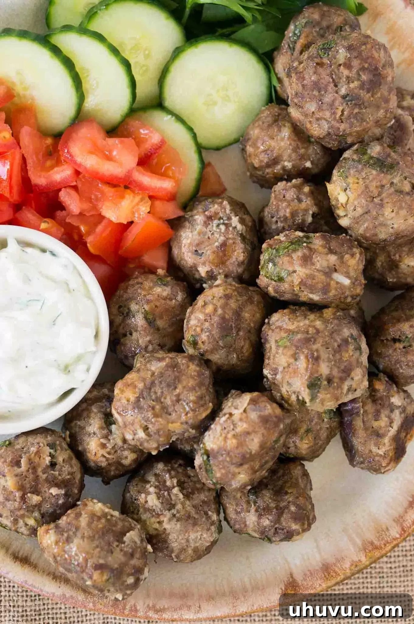 close up image of meatballs keftedes on a plate
