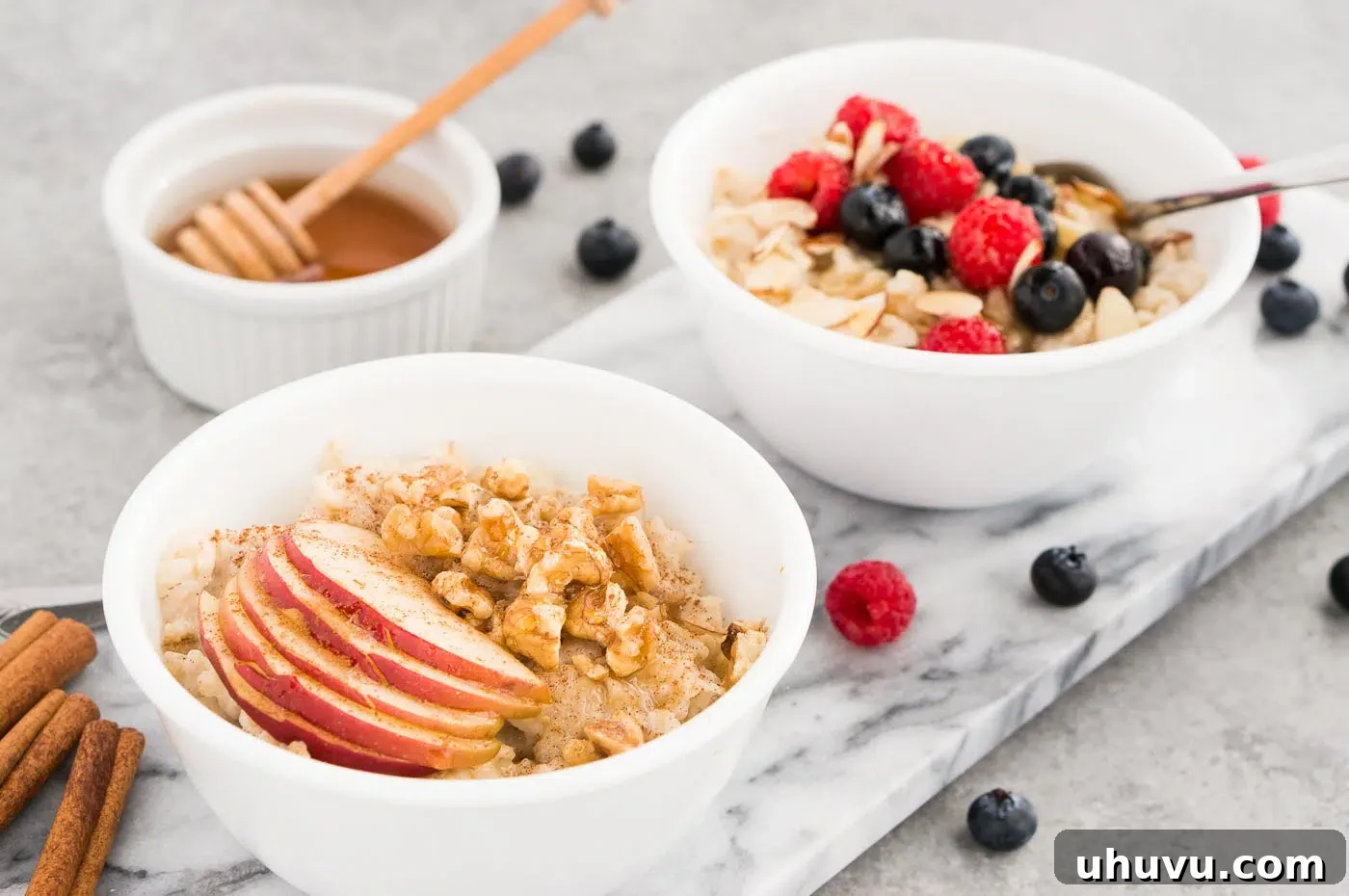 oatmeal with apples and berries in bowls