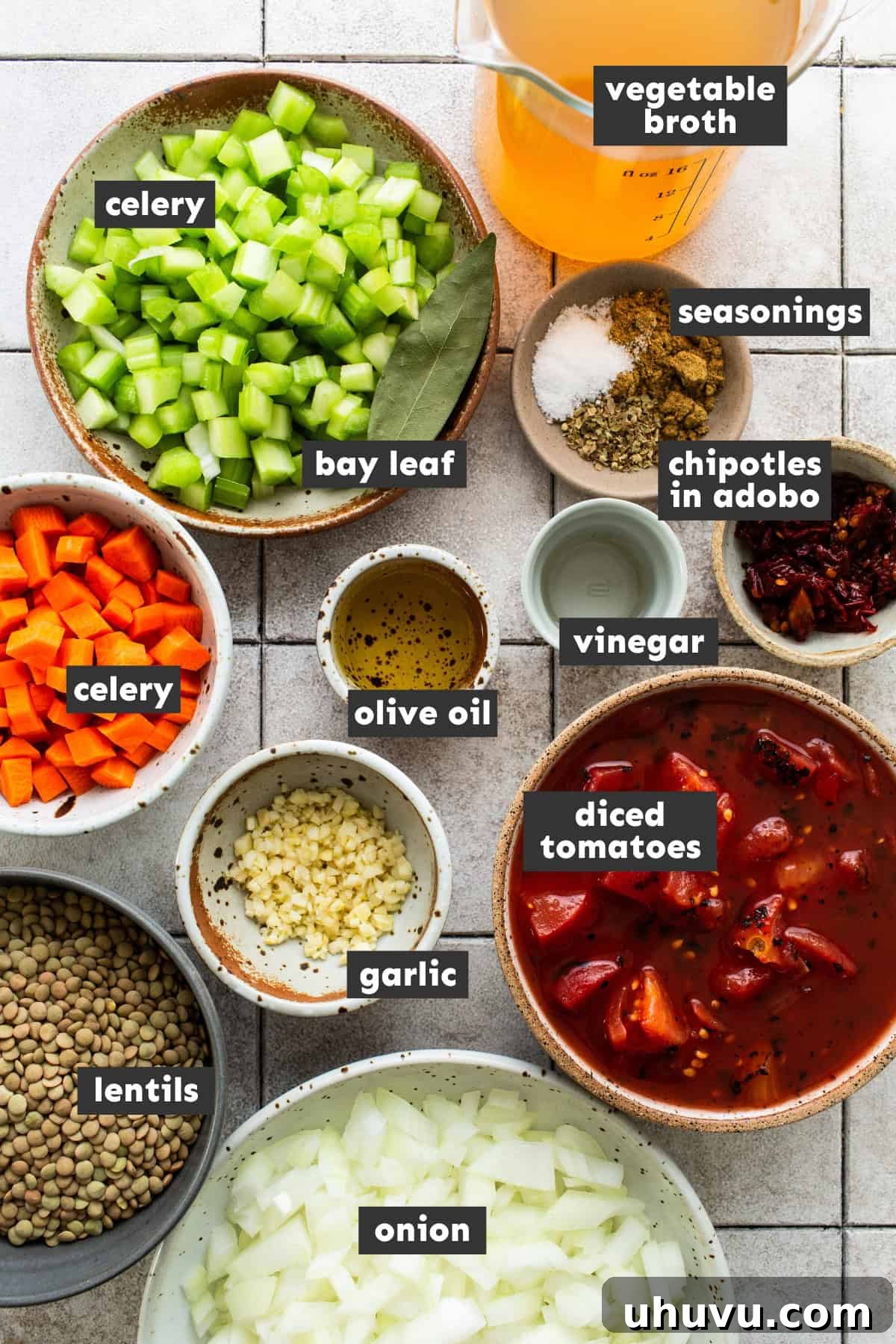 Ingredients for slow cooker lentil soup laid out on a wooden table.