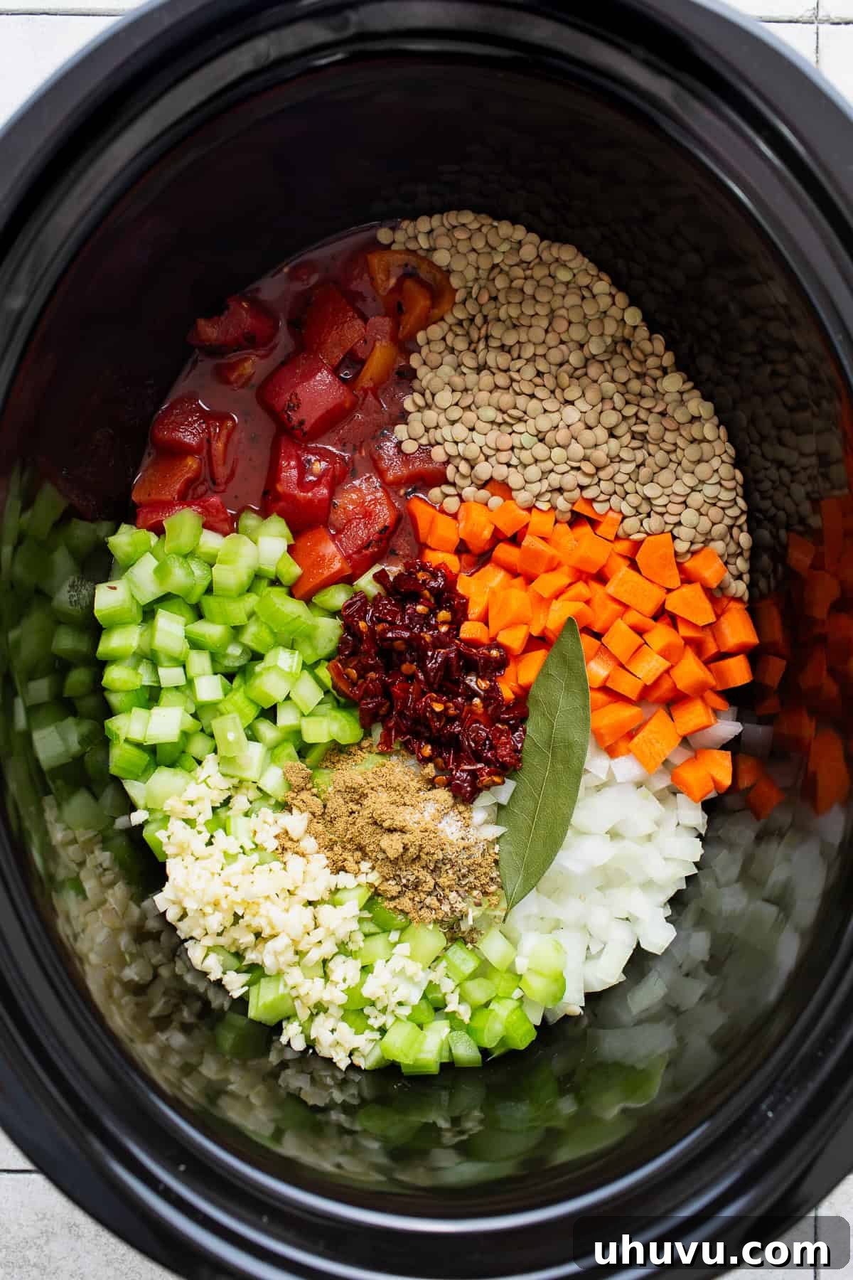 All ingredients for the soup loaded into a slow cooker.