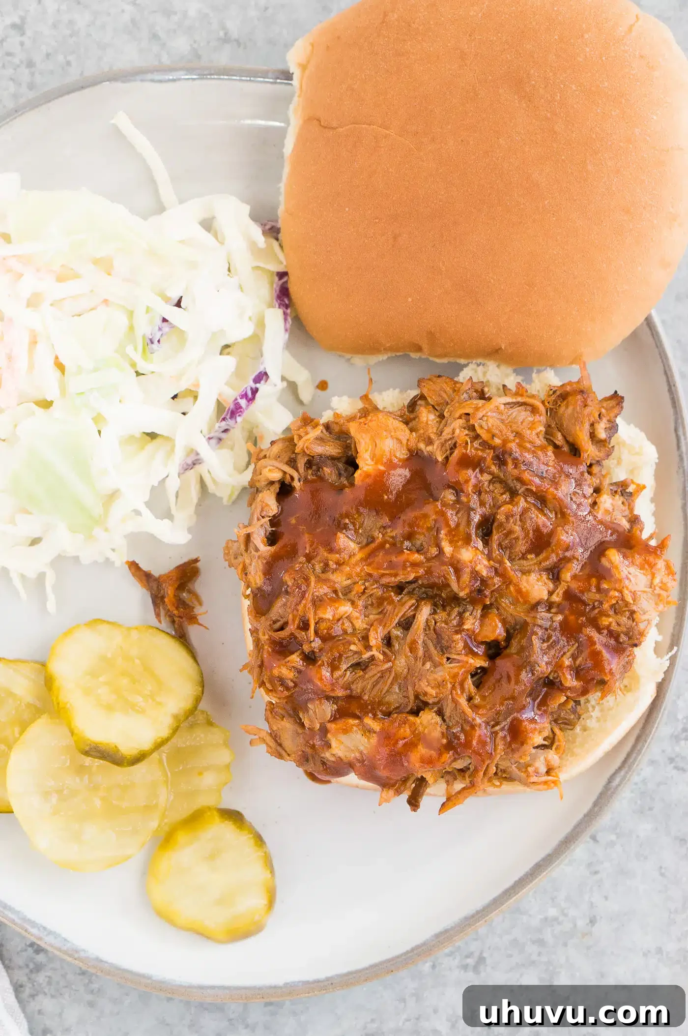 Effortless Instant Pot Pulled Pork 7 instant pot pulled pork served on a bun