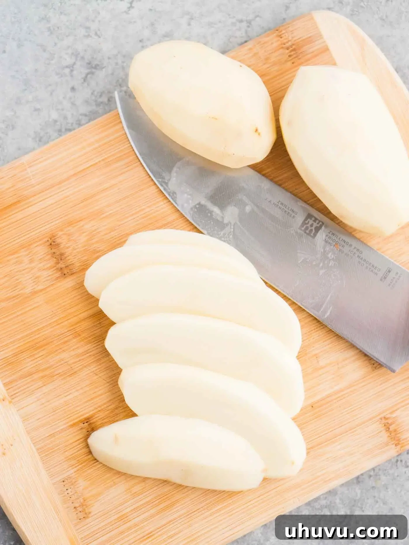 Sliced potatoes ready to be cut into fries