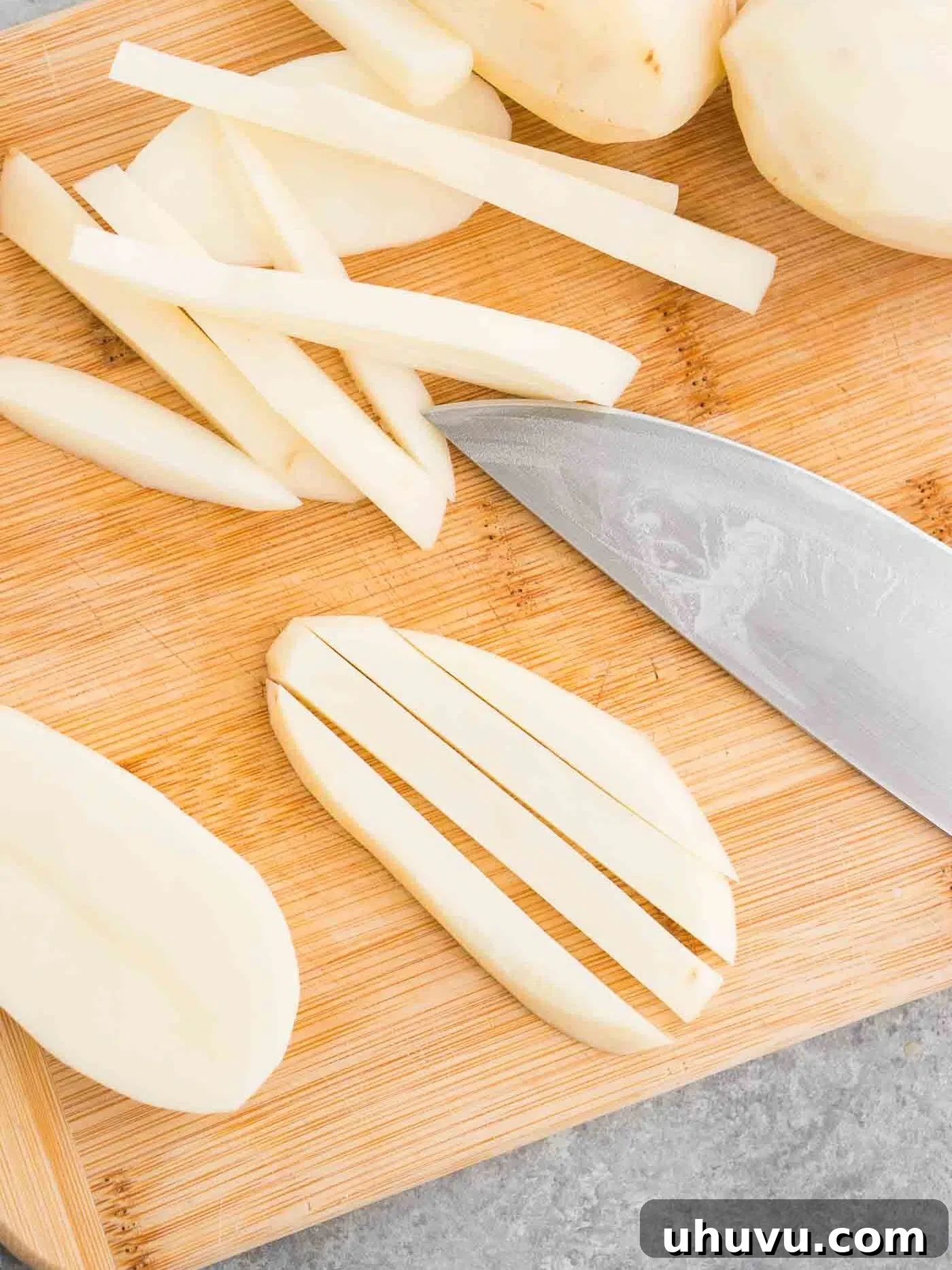 Potato slices cut into thin strips for French fries